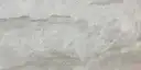 Closeup image of Perla Venato White Quartzite countertop slab